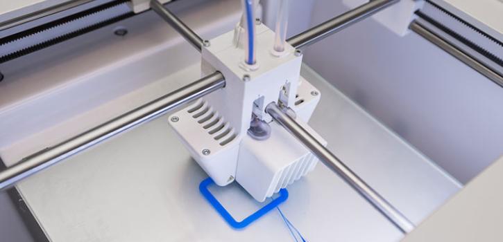 3D printer with blue filament 