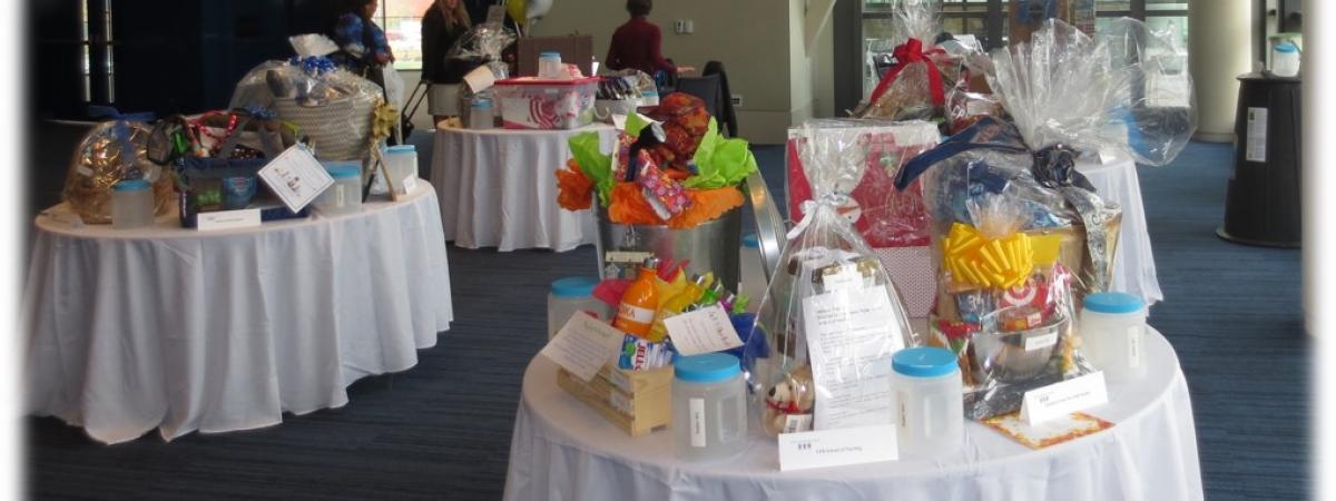 A photo of tables displaying baskets available for auction at the Basket Raffle