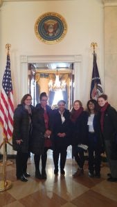 Six females posed inside the white house south lawn