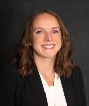 headshot of white woman in business attire 