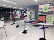 Photograph of Queer Love exhibit with informational panels