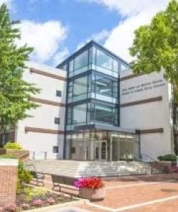 Image of outside photo of Jack, Joseph and Morton Mandel School of Applied Social Sciences with trees and front plaza with steps