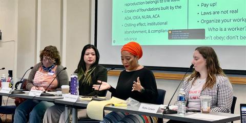 Panel discussion participants sitting at a table (ReproCussions panel Spring 2025)