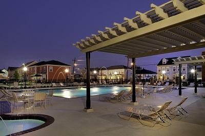 Night time view of pool and housing