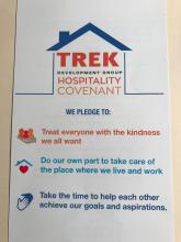 Trek Development logo. Underneath text reads We pledge to: treat everyone with the kingness we all want, do our own part to take care of the place where we live and work, take the time to help each other achieve our goals and aspirations.