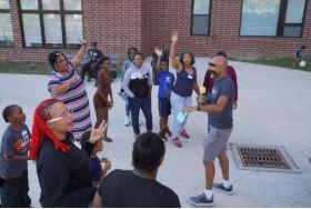 Playing a game at the Resident Empowerment Fund sponsored Treasure Hunt celebration.