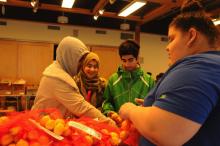 Woman around a table sewing