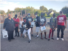 group of people posing for the camera wearing Respect the Groundhog t-shirts