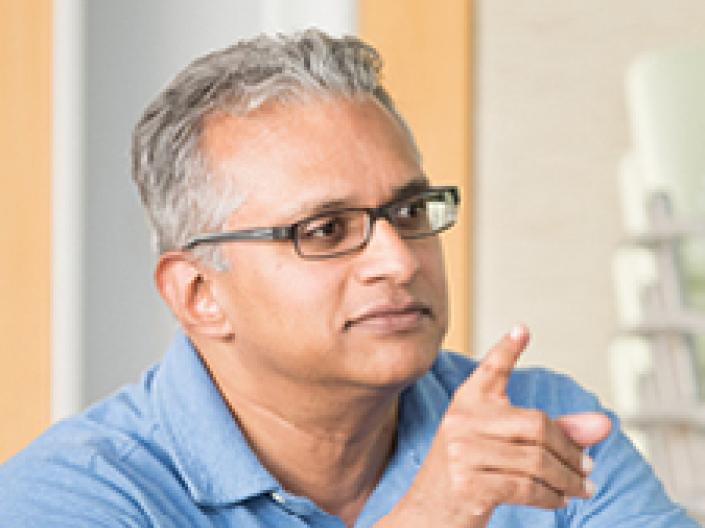 A man sitting and pointing