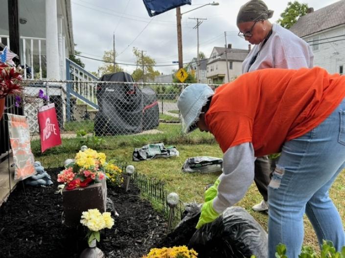 Two women working in a garden.