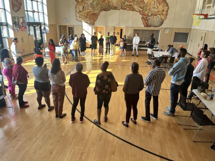 group of people standing in a circle