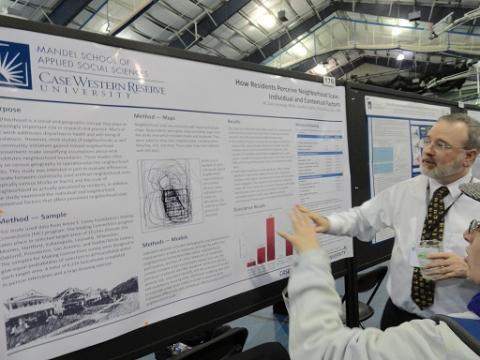 Men looking at research information