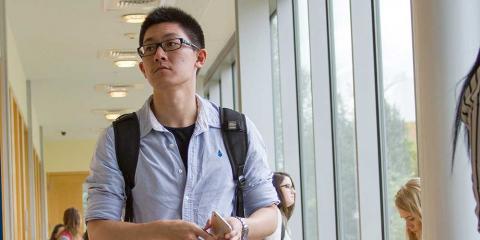 Student walking through hall