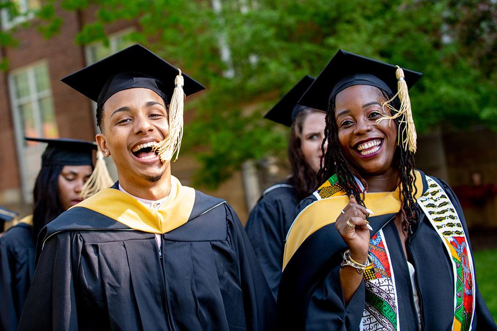 graduates laughing