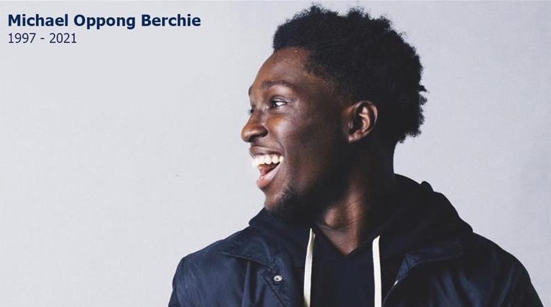 Profile view of Michael Berchie smiling