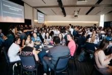 Students sitting at tables talking