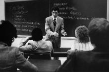 B&W photo of a young John Yankey teaching a class