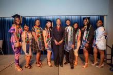 Adrianne Fletcher with all of the Mandel School's Black graduates 