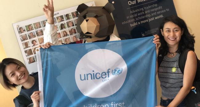 Students holding Unicef banner