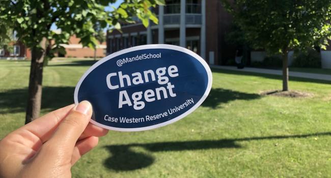 Change Agent sticker in front of building