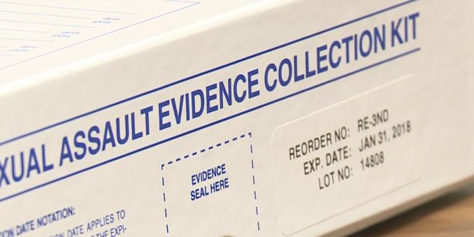 Image of box titled sexual assault evidence collection kit with text evidence seal here in blue dashed border, with sticker label with text reorder no: RE-3ND, exp. date: Jan 31st, 2018, Lot no: 14808