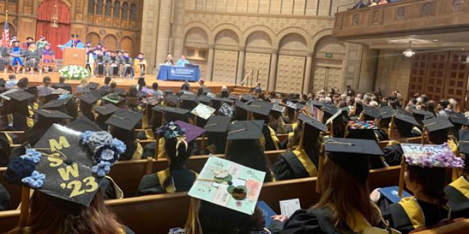 2023 graduates sitting and listening to Dean Voisin speak at commencement 2023 at the Maltz Performing Arts Center