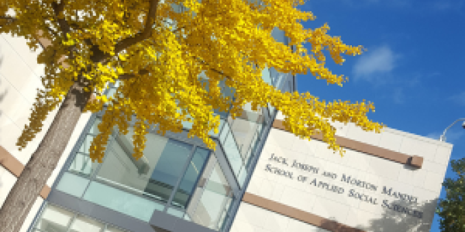 Mandel School exterior with fall leaves
