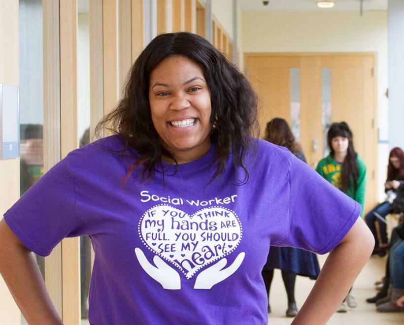 Social work student posing in hallway