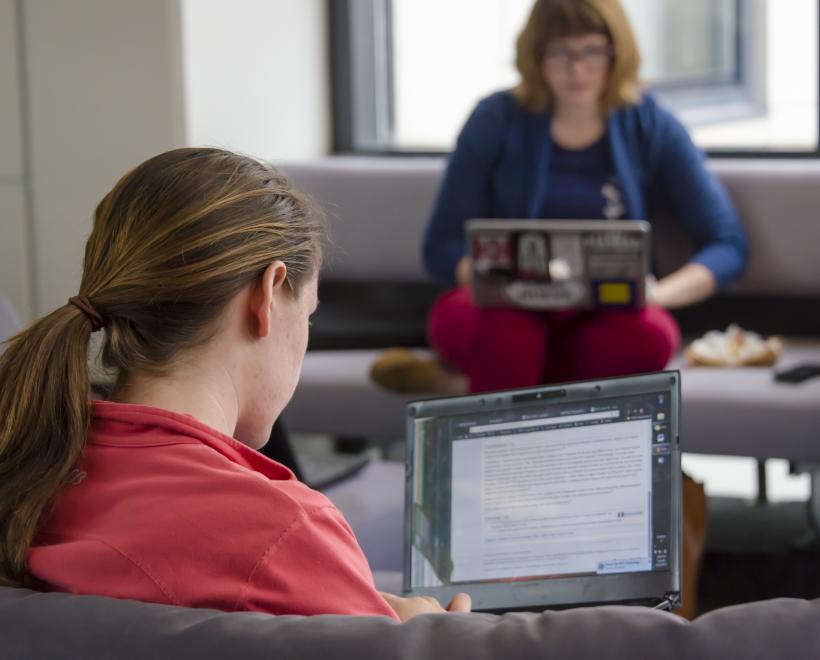 Two students working on computers