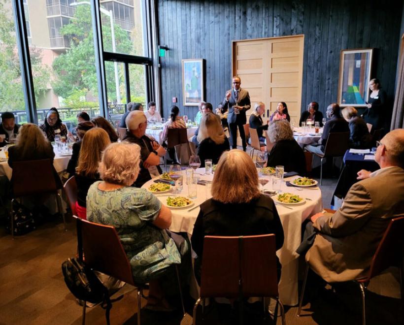 Dean Voisin talks to a room of alumni and friends at CSWE 2023