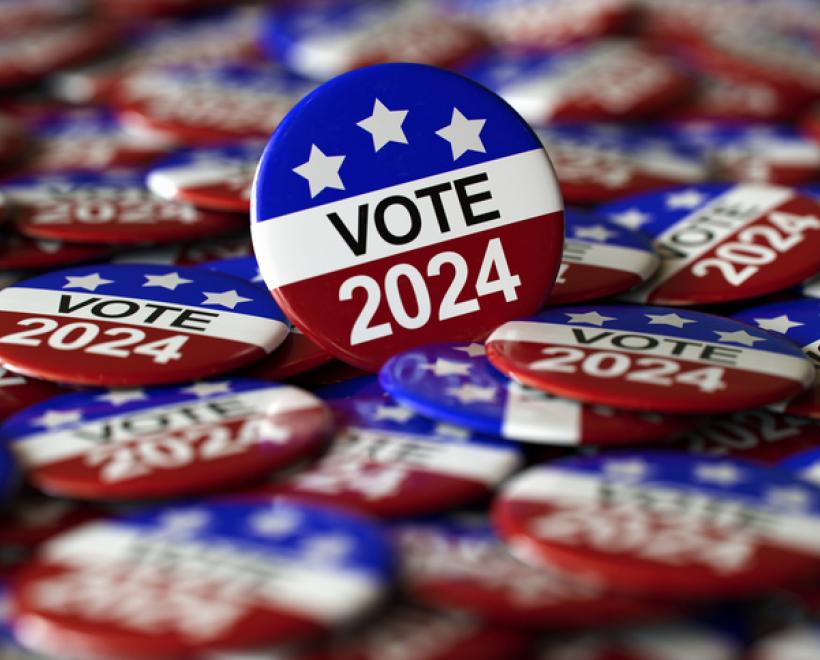 Pile of election buttons with "Vote 2024" written on them