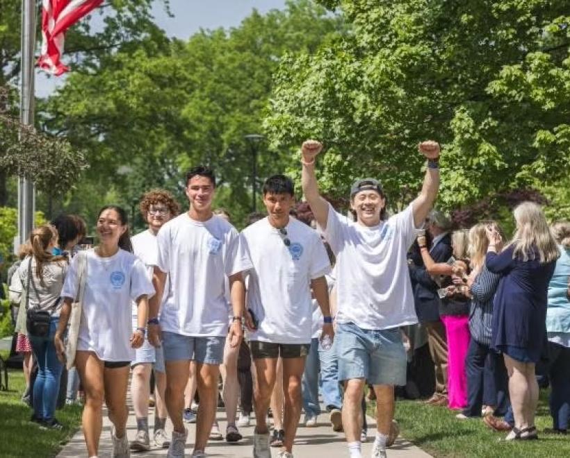 Students process up the quad in celebration