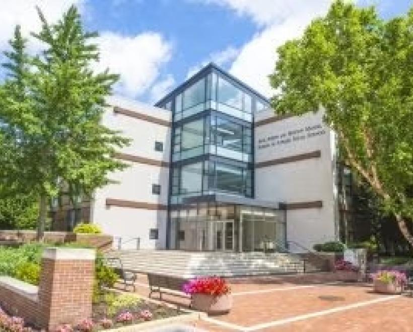Image of outside photo of Jack, Joseph and Morton Mandel School of Applied Social Sciences with trees and front plaza with steps