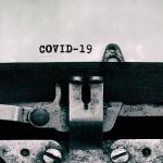 "COVID-19" written on paper in a typewriter