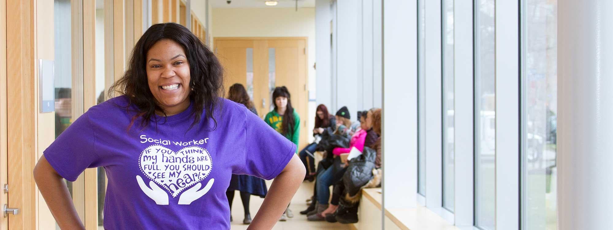 Social work student posing in hallway