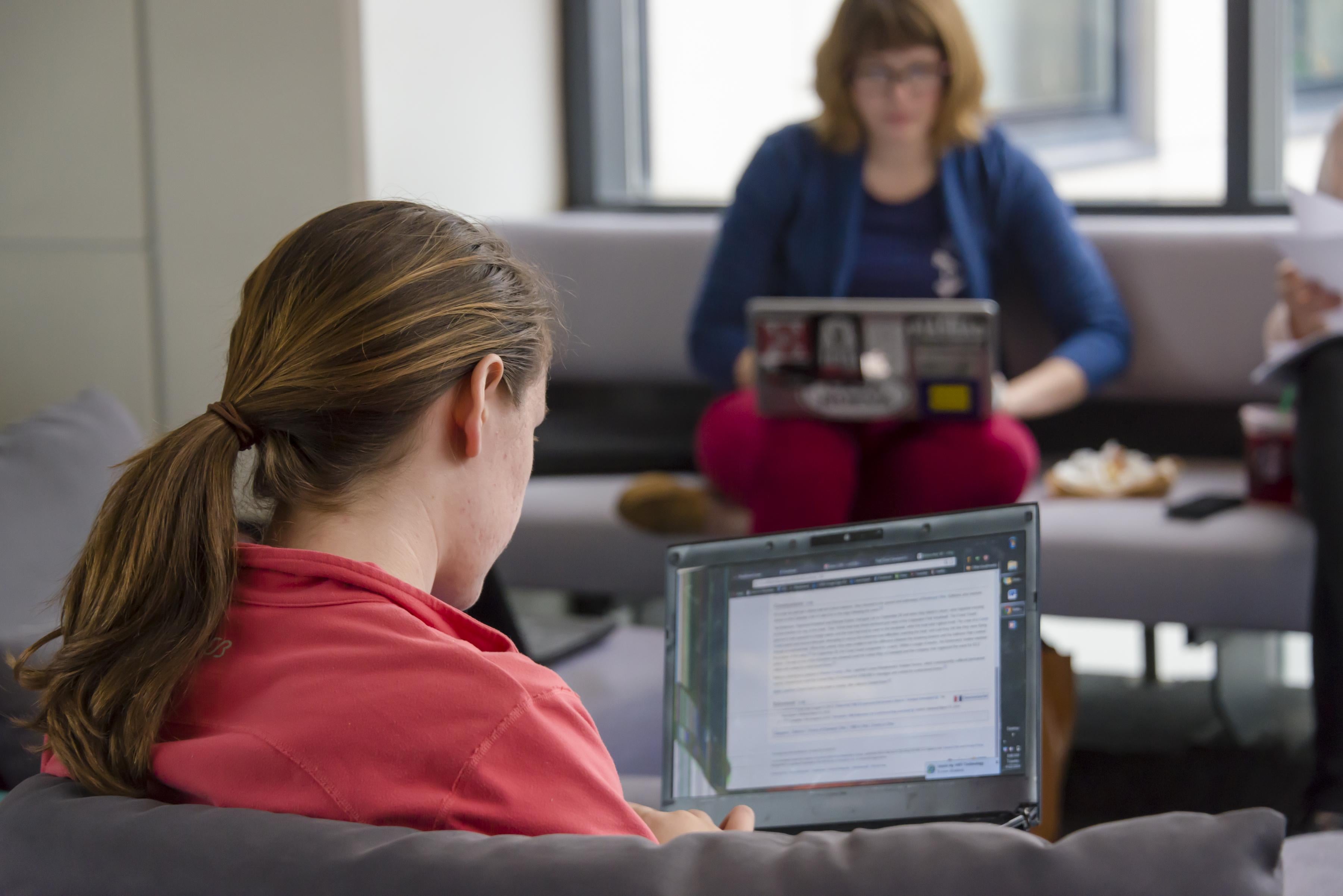 Two students working on computers