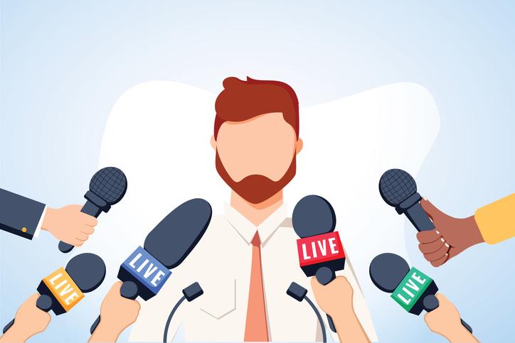 Illustration of a man in front of several reporters with microphones