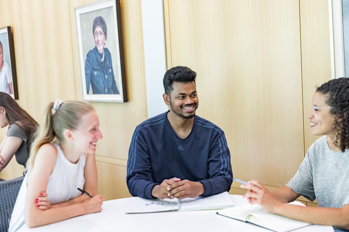 people sitting around a table talking