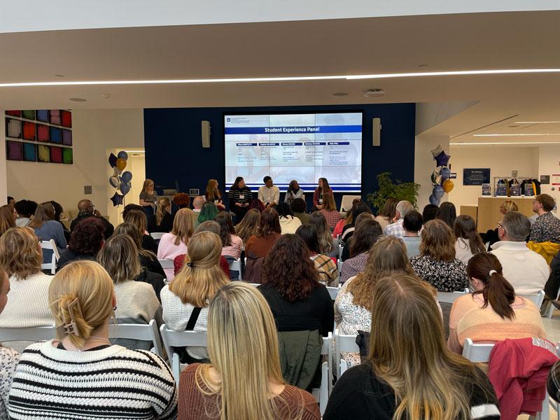 Prospective students listening to a panel of speakers at MSW Open House 2024