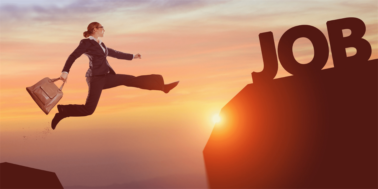 Woman in mid-air leaping to a "JOB" sign