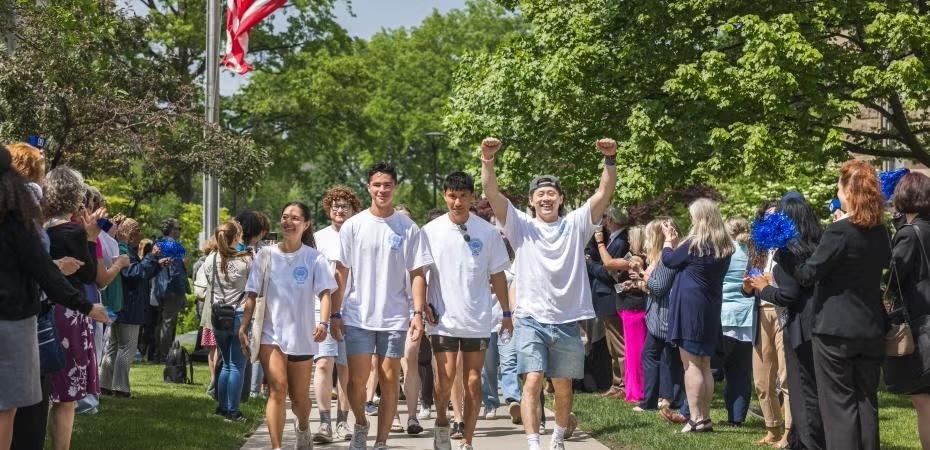 Students process up the quad in celebration