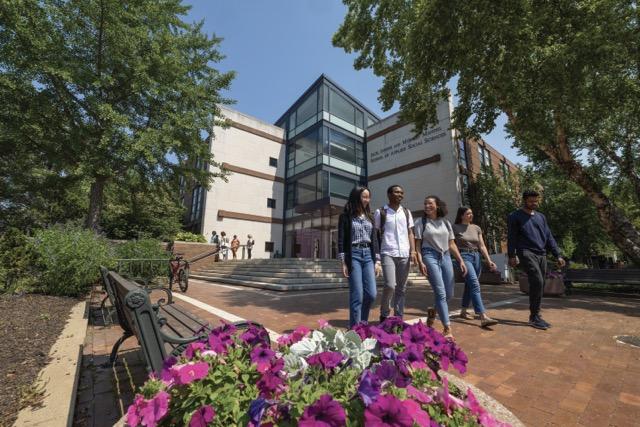 Students walking outside of academic building