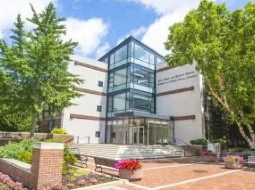 Image of outside photo of Jack, Joseph and Morton Mandel School of Applied Social Sciences with trees and front plaza with steps