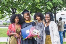 Graduate with her supporters after commencement