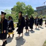 2022 graduates walking into Maltz