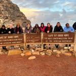Crystal Sledge (far left), Toni Shoyinka (fifth from left), Allysia White (seventh from left) pose with their study abroad cohort at Cape of Good Hope in South Africa last summer (Photo courtesy of Toni Shoyinka)