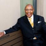Louis Stokes sitting on a bench