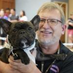 Scott D. Ryan holds his French Bulldog, Moose