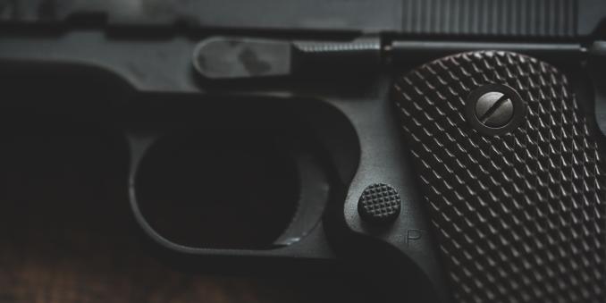 Close-up image of a black gun