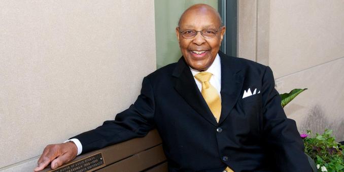 Louis Stokes sitting on a bench